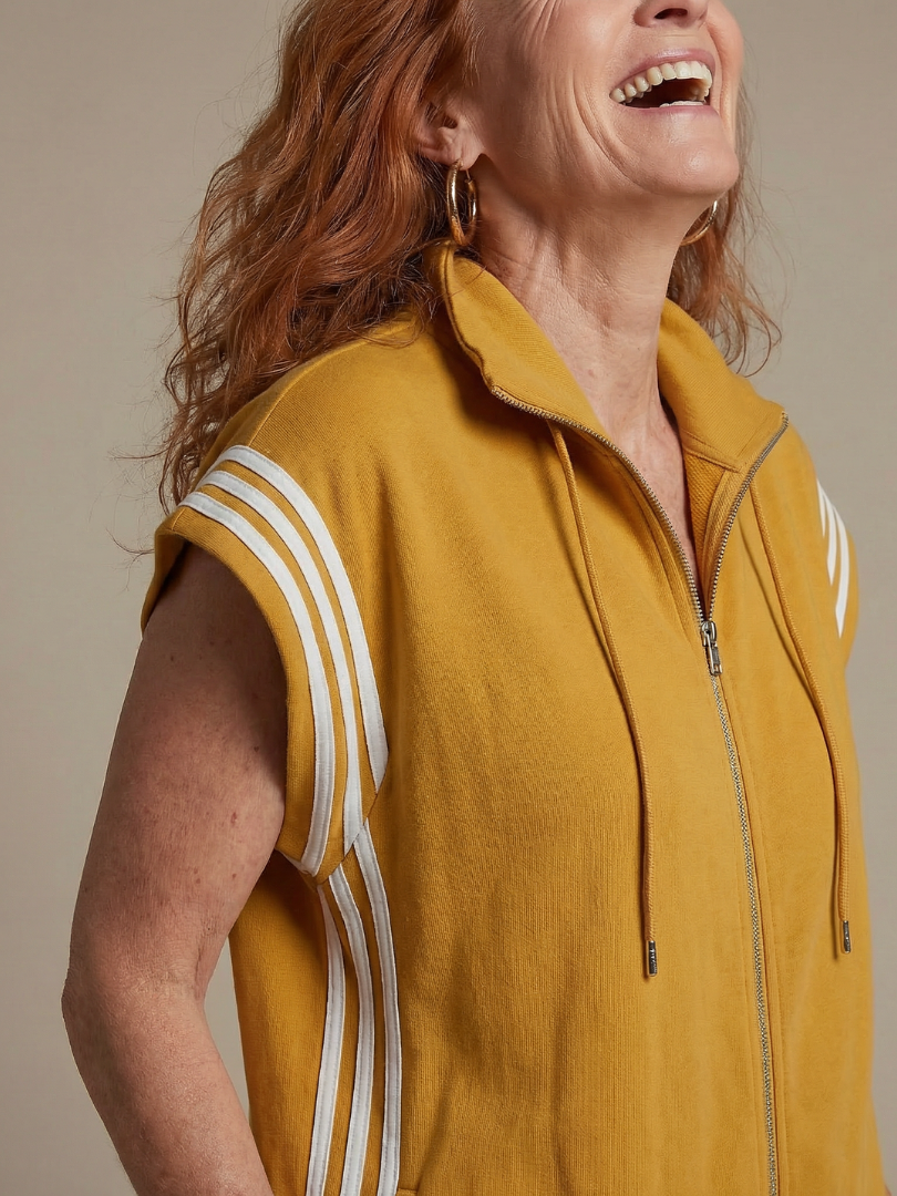 Women’s sleeveless zip-front jumpsuit close-up in yellow with white striped sleeves