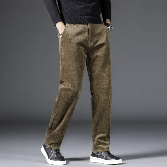 Medium-waist corduroy pants in olive brown with front pockets and belt loops