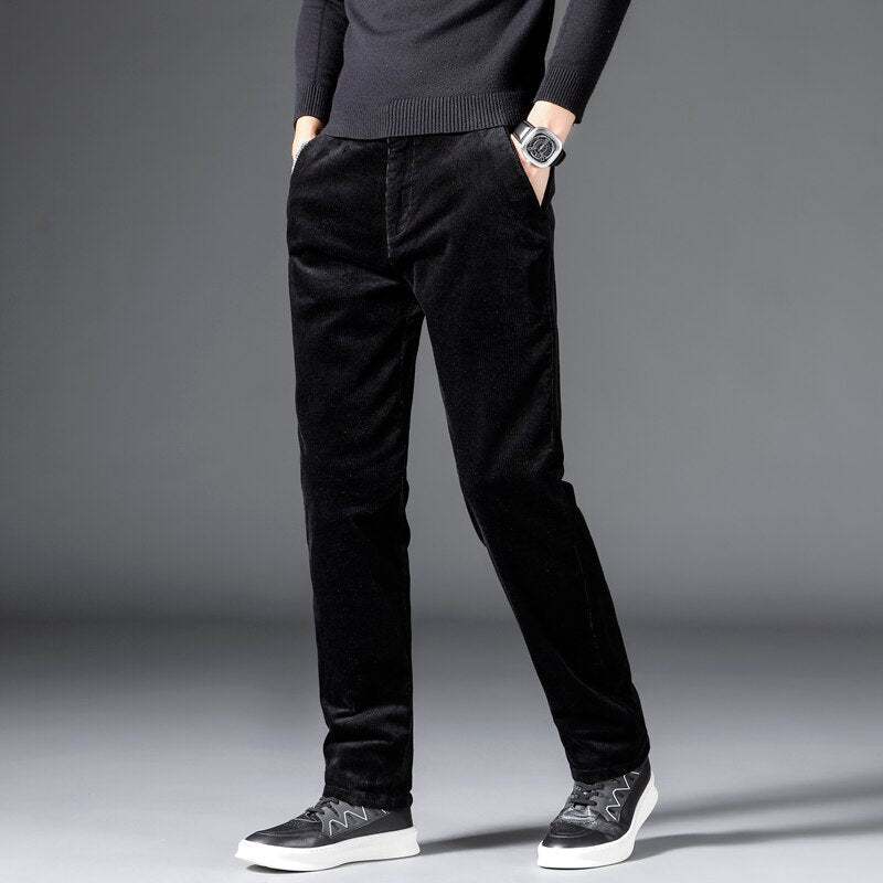 Medium-waist corduroy pants in black with front pockets, straight fit