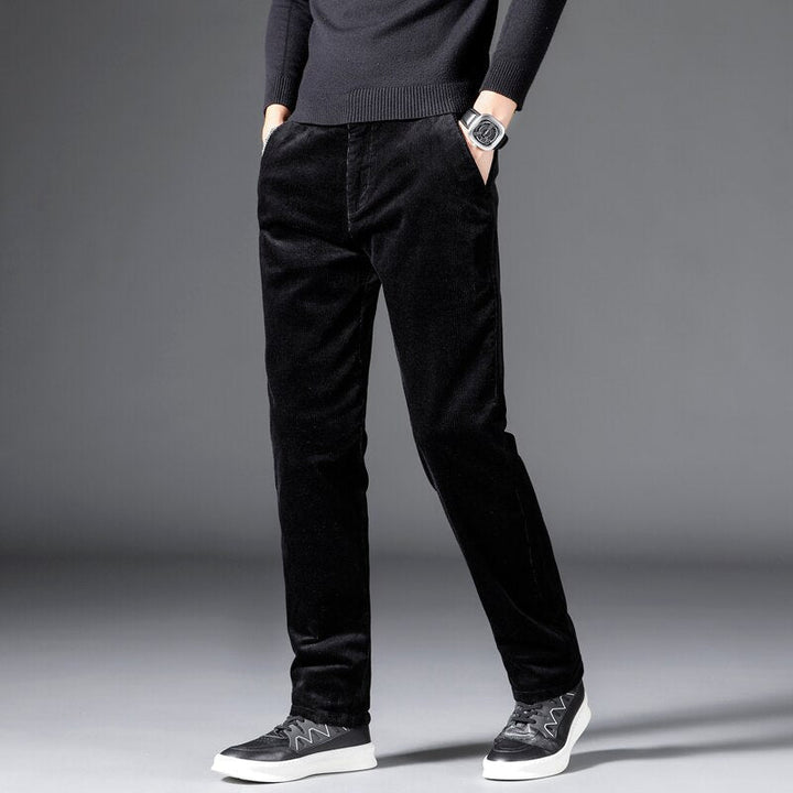 Medium-waist corduroy pants in black with front pockets, straight fit