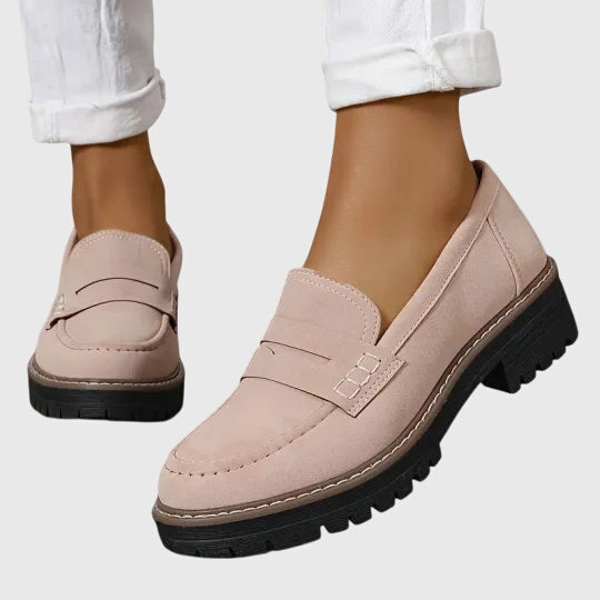 Blush pink chunky slip-on loafers with strap detail and dark lug sole