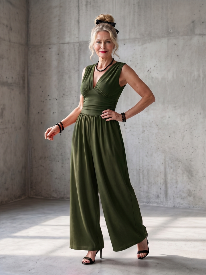 Green twist-front sleeveless jumpsuit with gathered waist and wide-leg pants