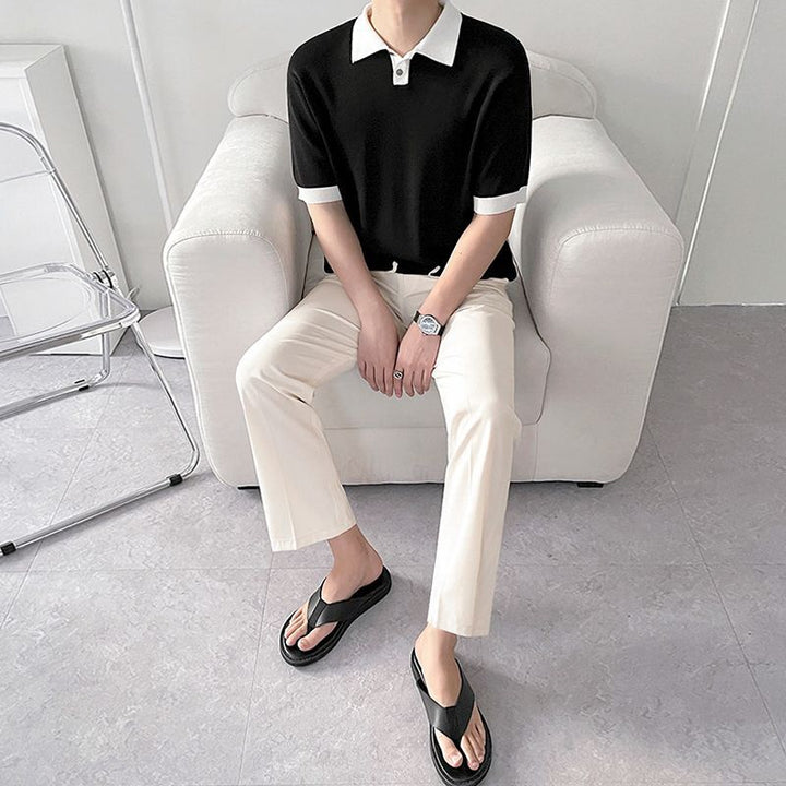Men's wide-sleeve polo shirt, black knit with white collar trim and ribbed sleeve cuffs