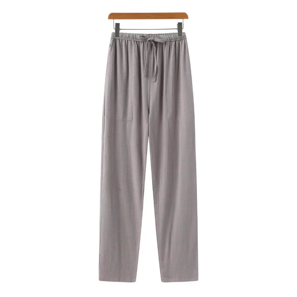 Gray linen pants with elastic waistband and drawstring, relaxed straight legs.