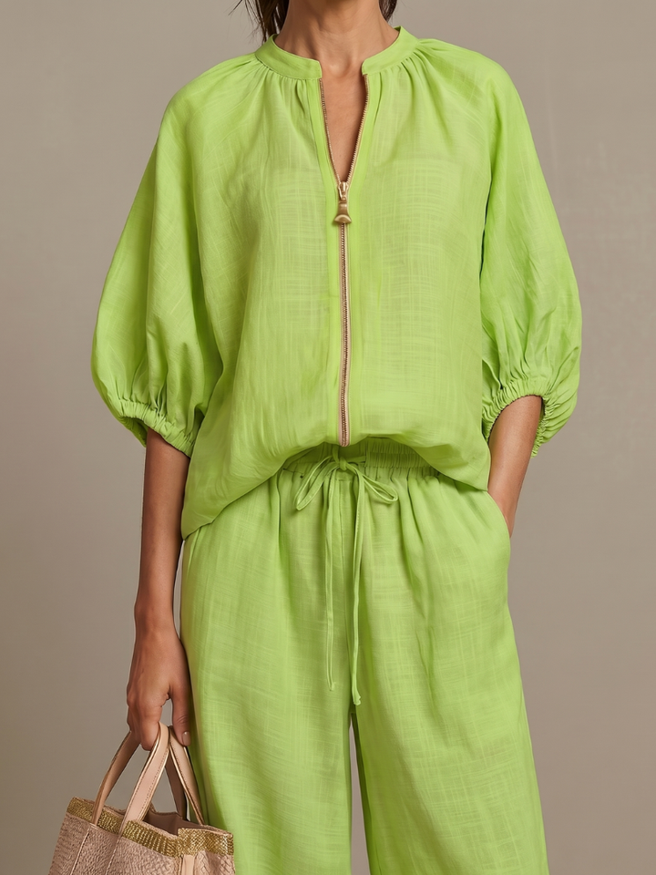 Green zip-front blouse and matching drawstring wide-leg pants, puff sleeves