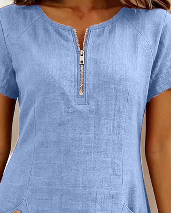 Light blue casual dress with a centered half-zip placket and short sleeves
