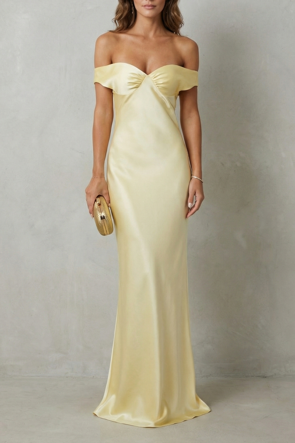 Yellow off-shoulder satin gown with sweetheart neckline and draped bust