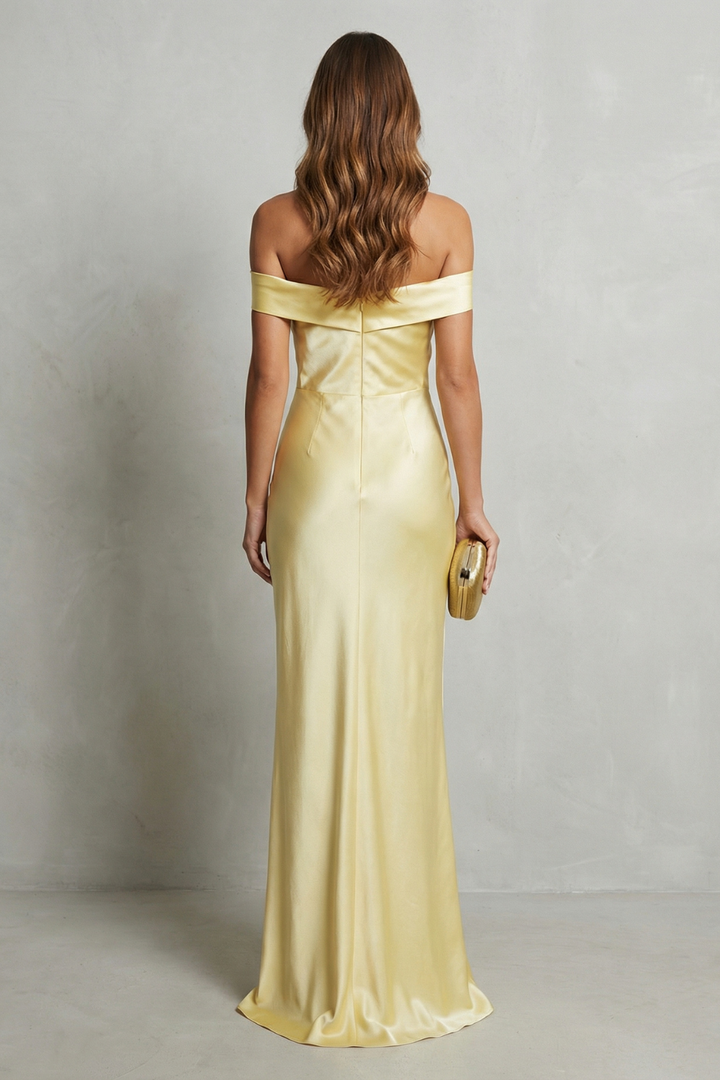 Yellow off-shoulder satin gown, back view with gathered seam and long skirt
