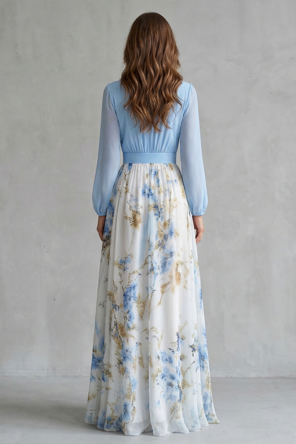 Back view light blue maxi dress with long sleeves and elastic waist over floral skirt