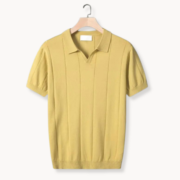 Yellow cotton polo shirt on hanger with ribbed vertical knit texture and knit collar