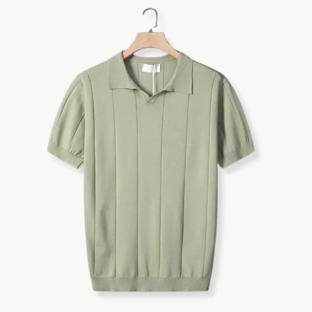 Green cotton polo shirt on hanger with vertical ribbed knit texture and knit collar