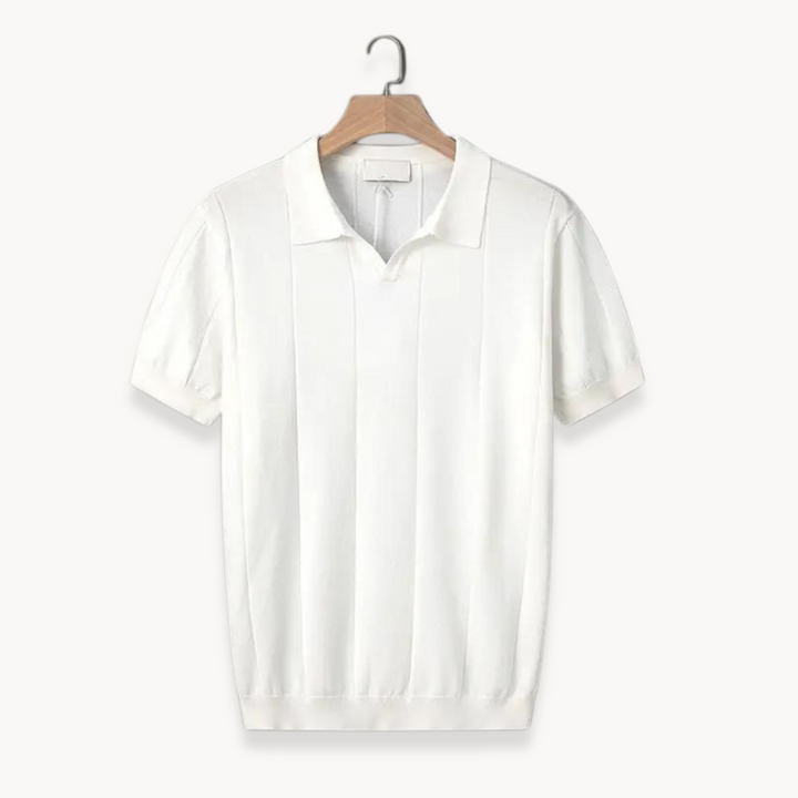White cotton polo shirt on hanger with ribbed vertical knit texture and knit collar