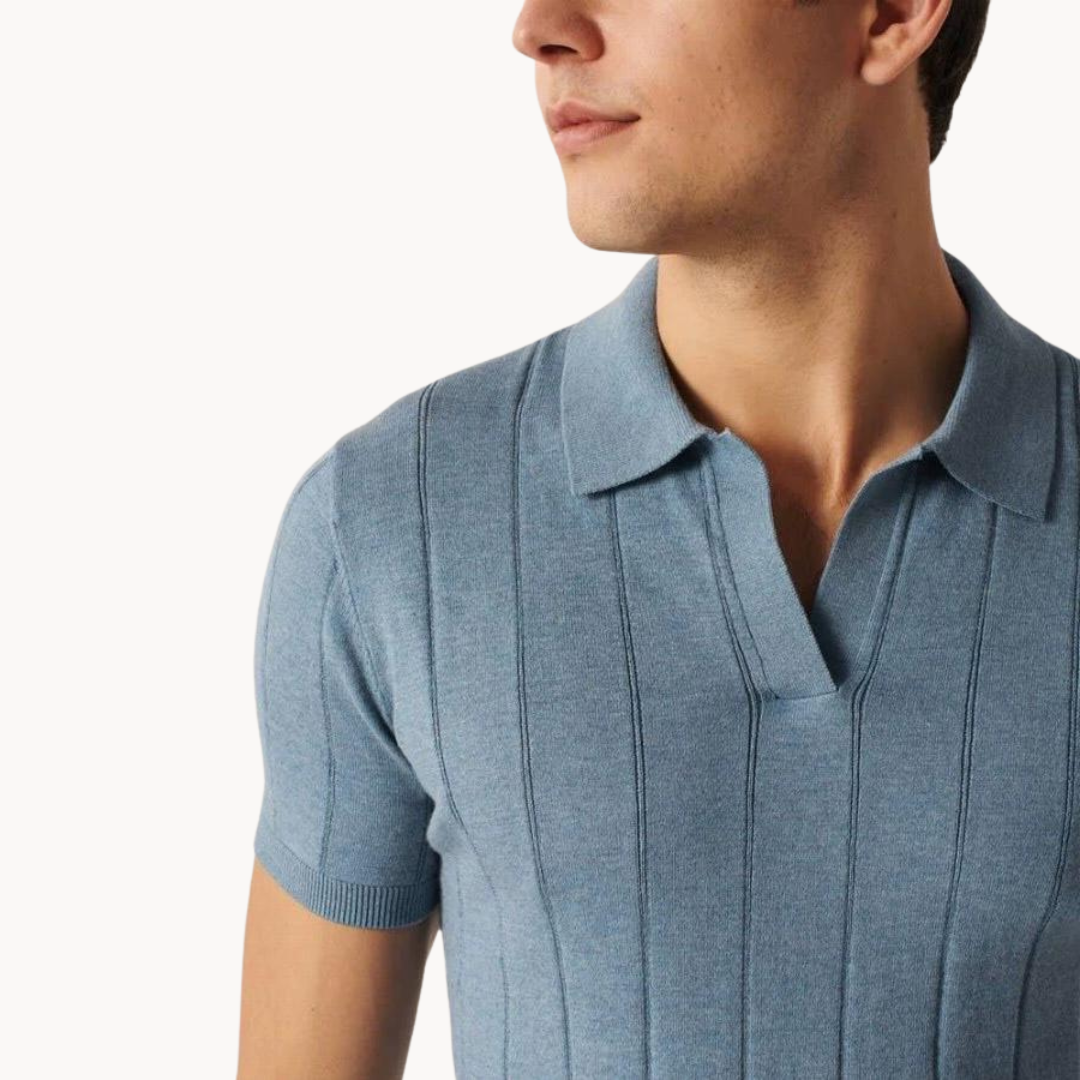 Blue cotton knit polo shirt close-up showing collar and vertical ribbed stripes