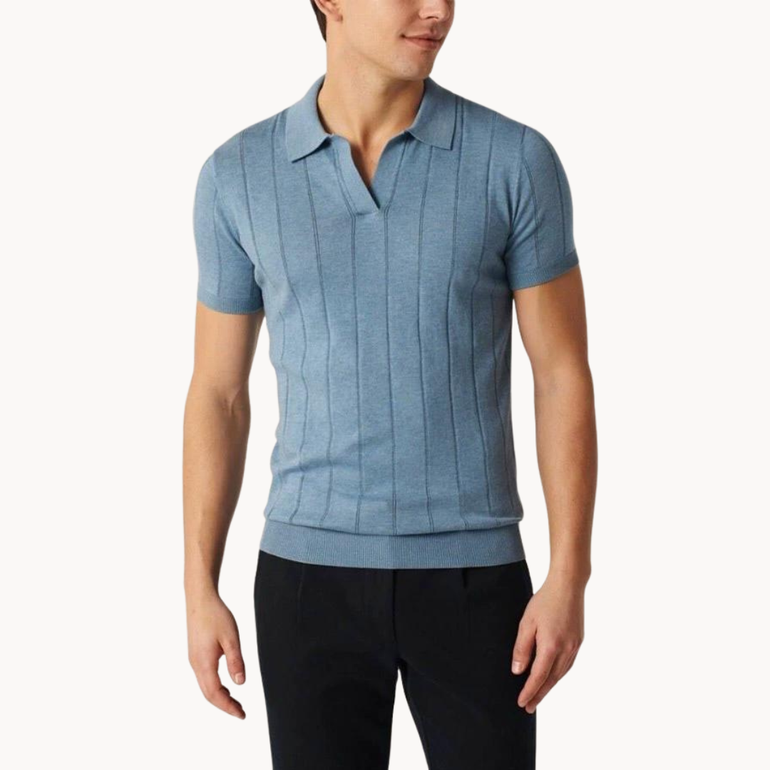 Blue cotton knit polo shirt on model with short sleeves and fitted hem