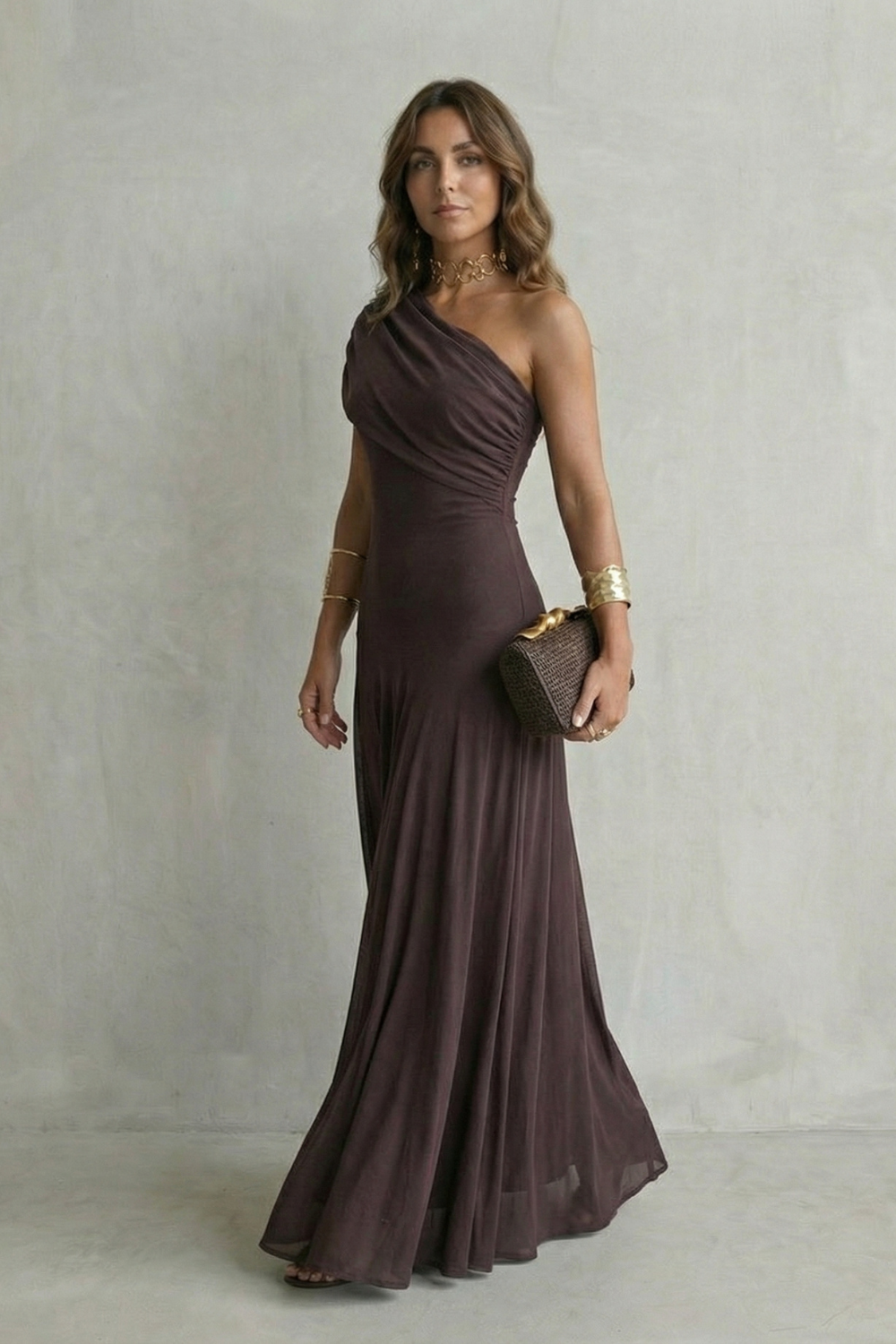 One-shoulder maxi dress in dark plum with fitted waist and flowing skirt