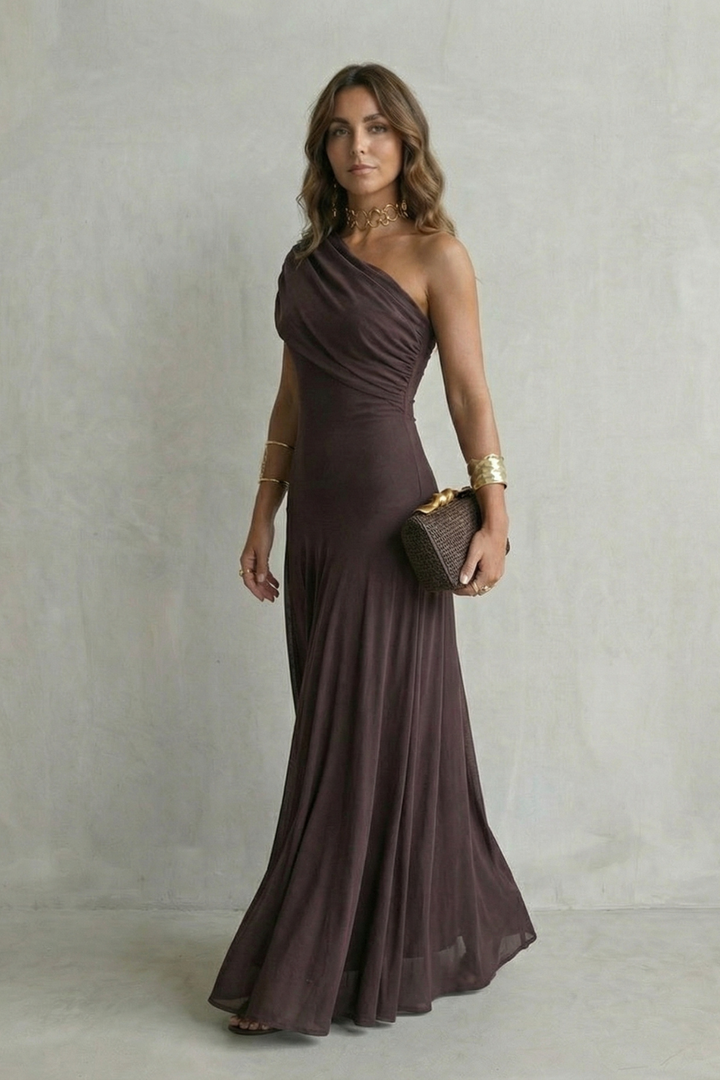 One-shoulder maxi dress in dark plum with fitted waist and flowing skirt