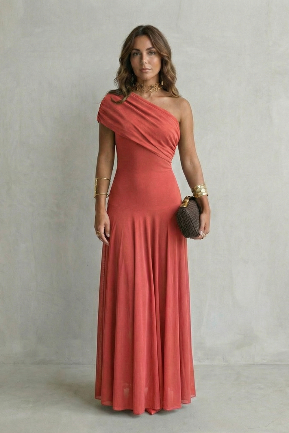 One-shoulder maxi dress in coral red with fitted bodice and flared maxi skirt