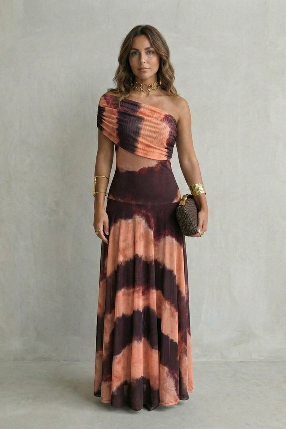 One-shoulder maxi dress with tie-dye print in peach, rose, and dark brown