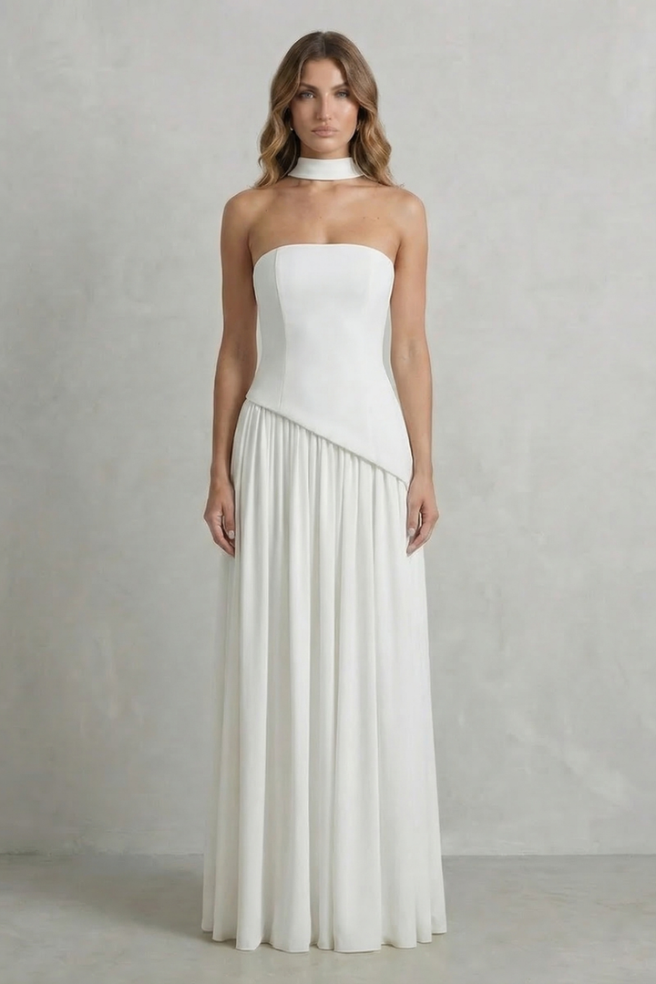 White strapless draped maxi dress with ruched waistband and flowing pleated skirt