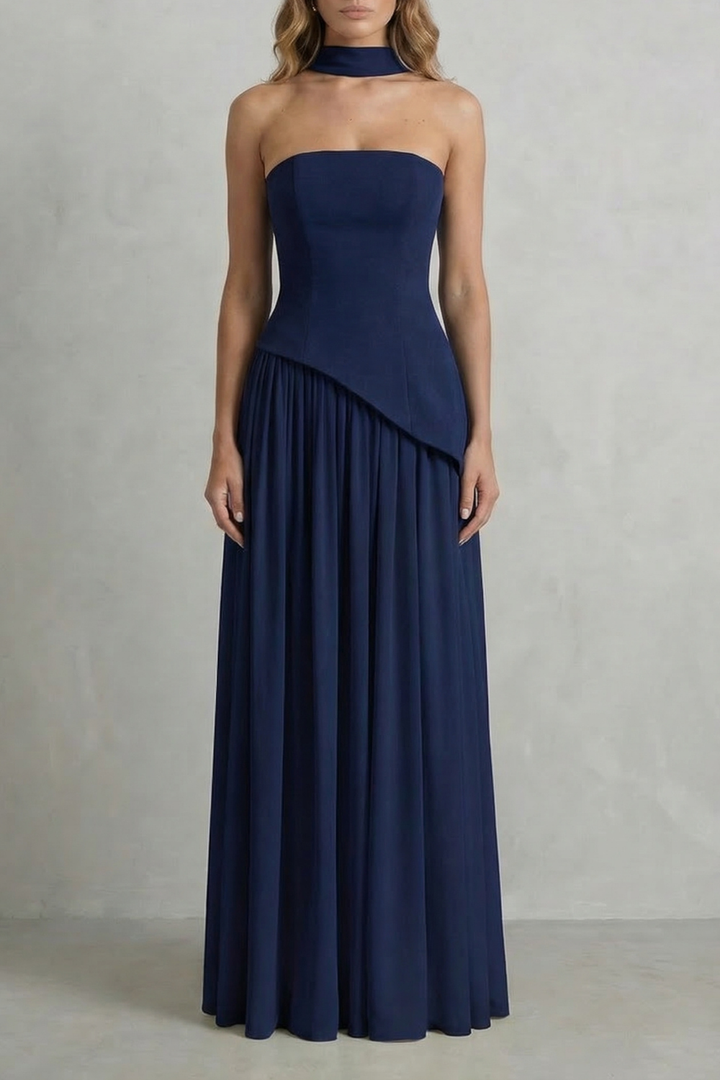 Navy strapless draped maxi dress with asymmetric overlay and pleated skirt