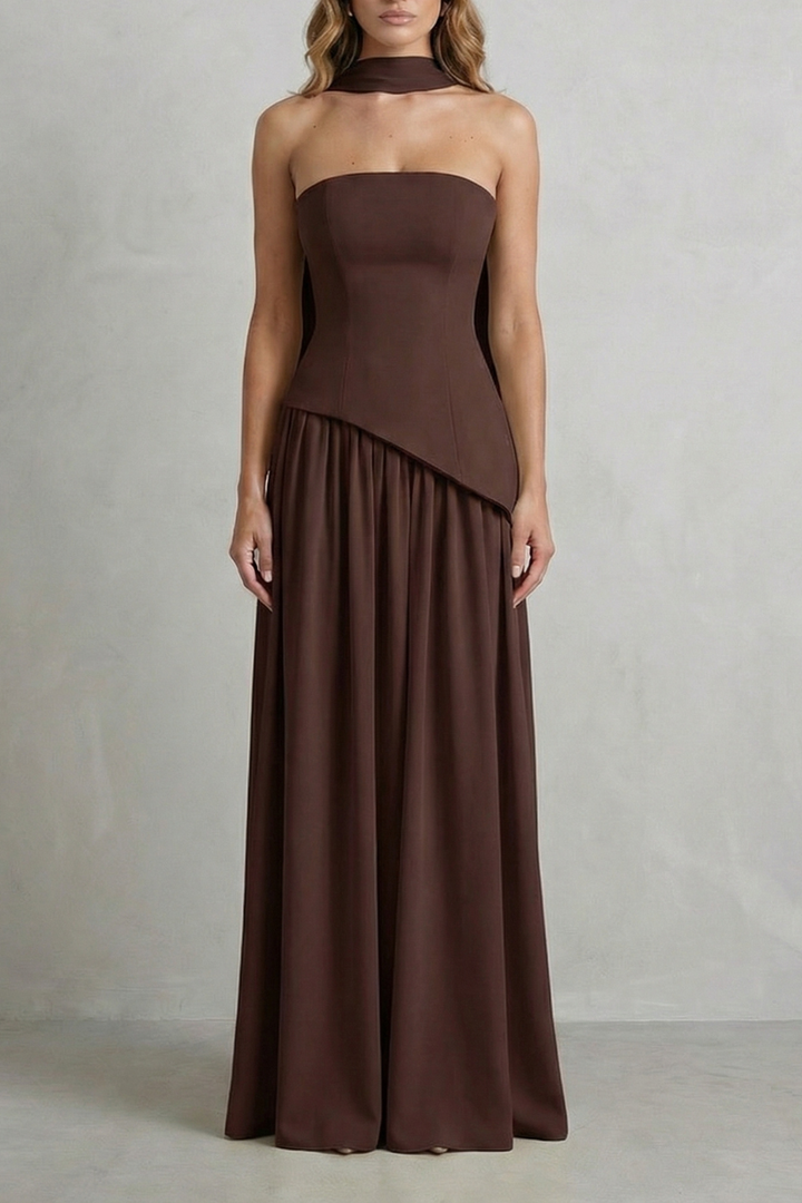 Dark brown strapless draped maxi dress with paneled bodice and flowing skirt