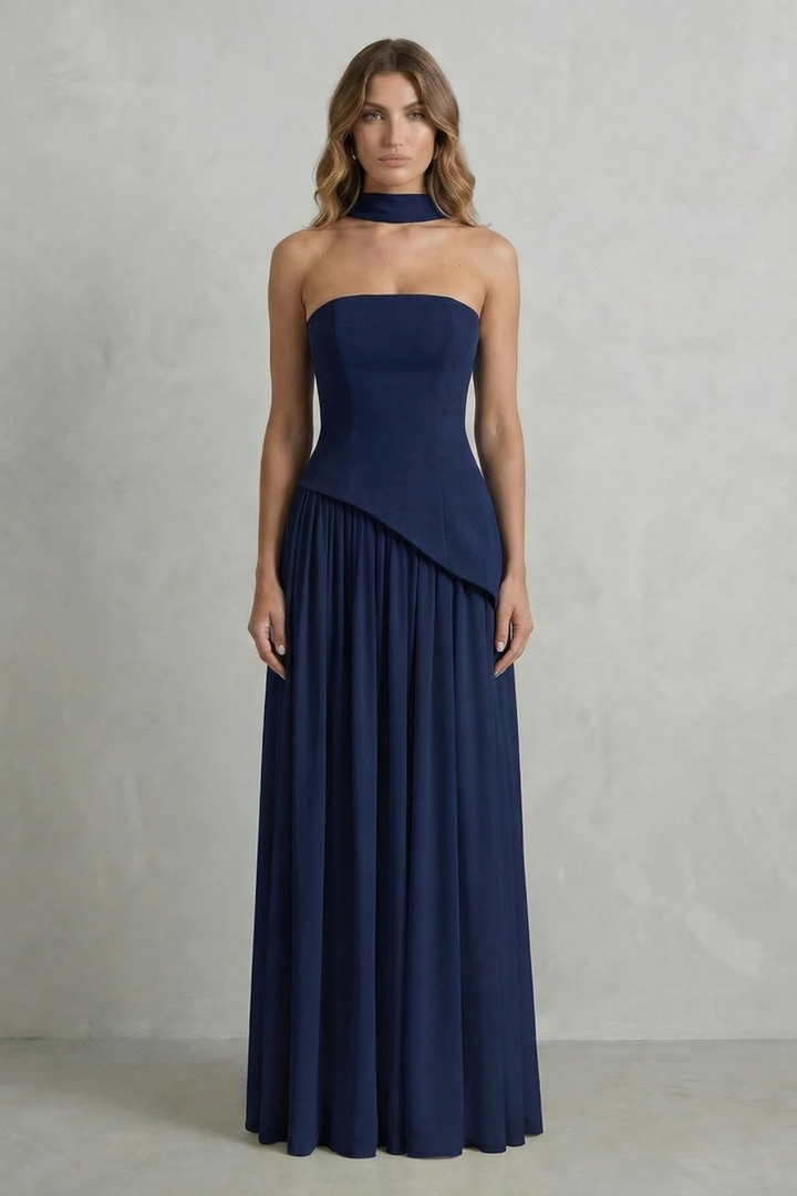Navy strapless draped maxi dress with diagonal overlay and gathered pleat skirt