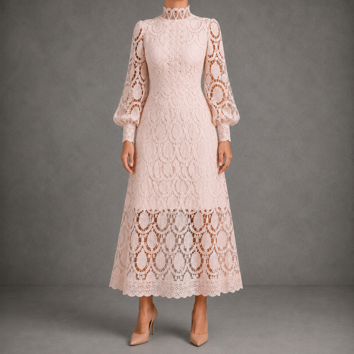 Lace maxi dress with high neck, long puff sleeves, and scalloped hem in blush pink.
