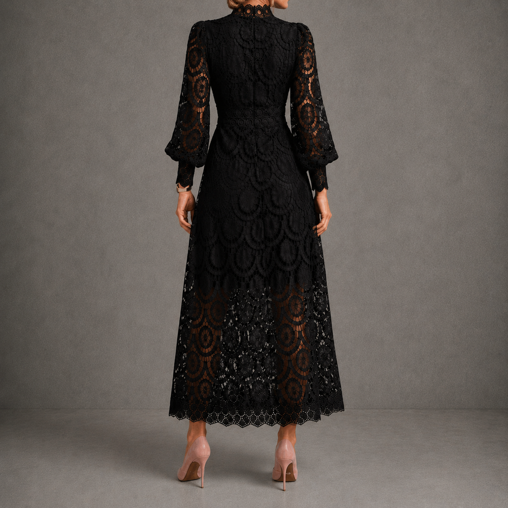 Black lace maxi dress, rear view, high neck and long sheer sleeves, scalloped hem