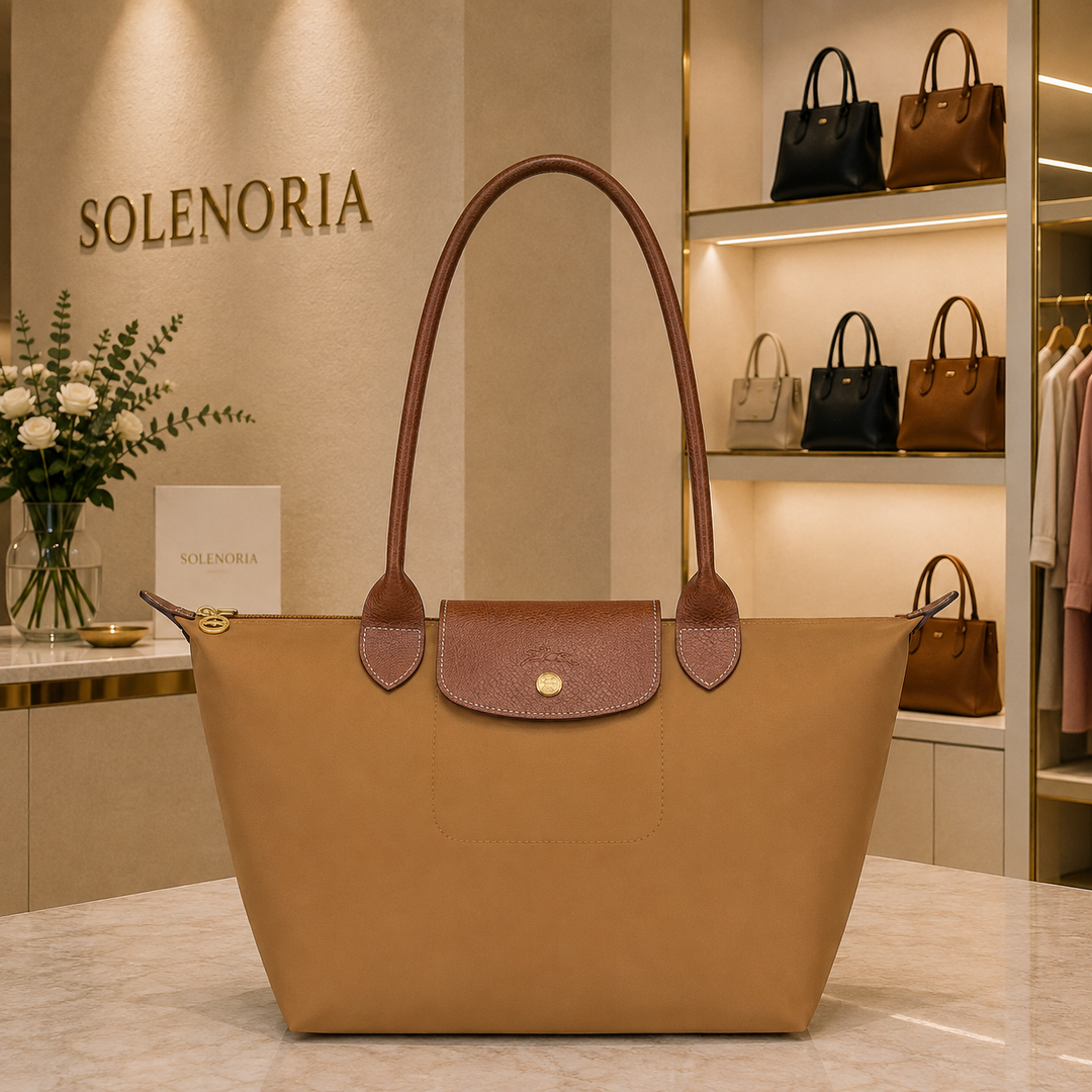 Medium fawn tote bag with brown leather trim, front flap pocket and gold snap