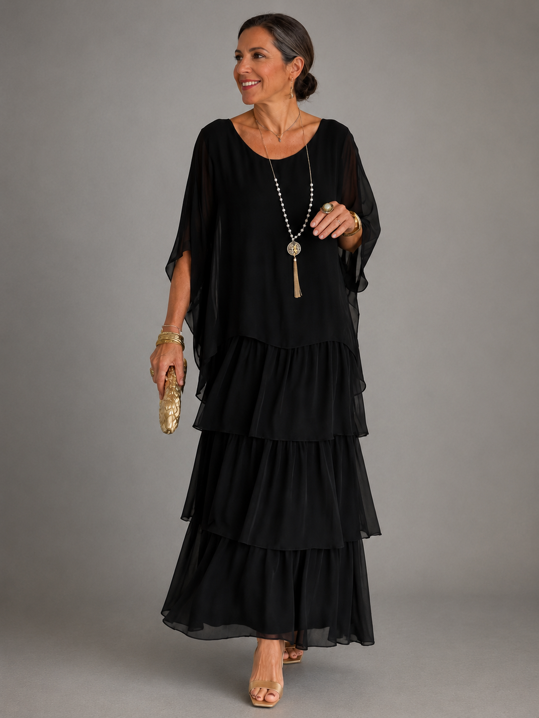 Black tiered maxi dress with layered skirt and loose dolman sleeves