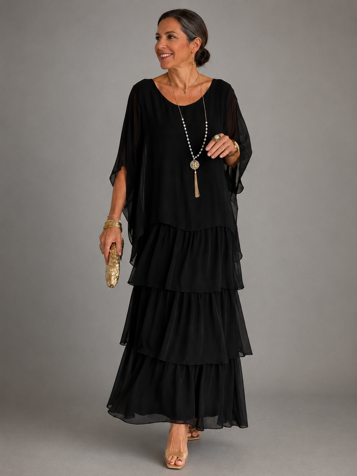 Black tiered maxi dress with layered skirt and loose dolman sleeves
