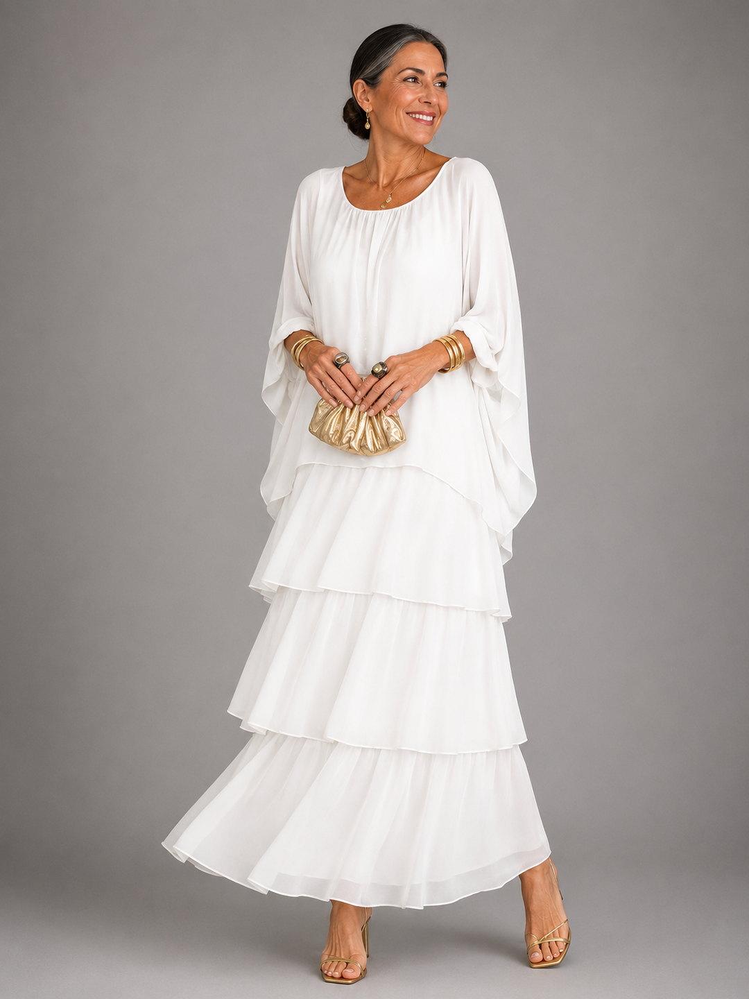 White tiered maxi dress with loose sleeves and ruffled layered skirt