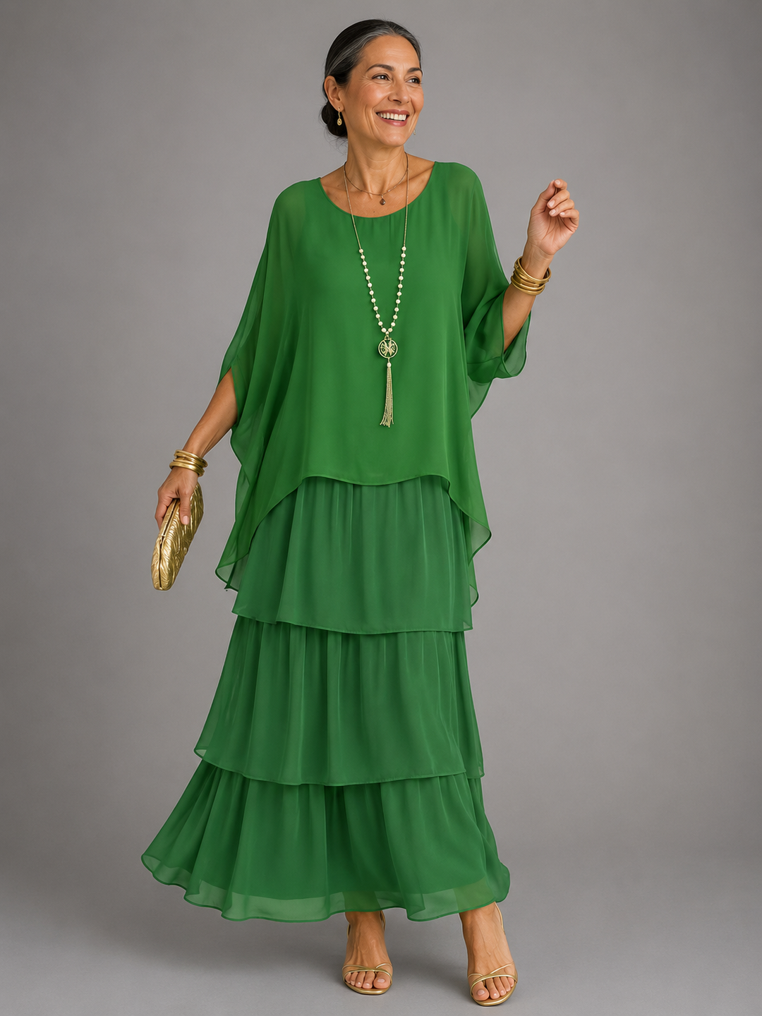 Dark green tiered maxi dress with draped sleeves and flowing layered skirt