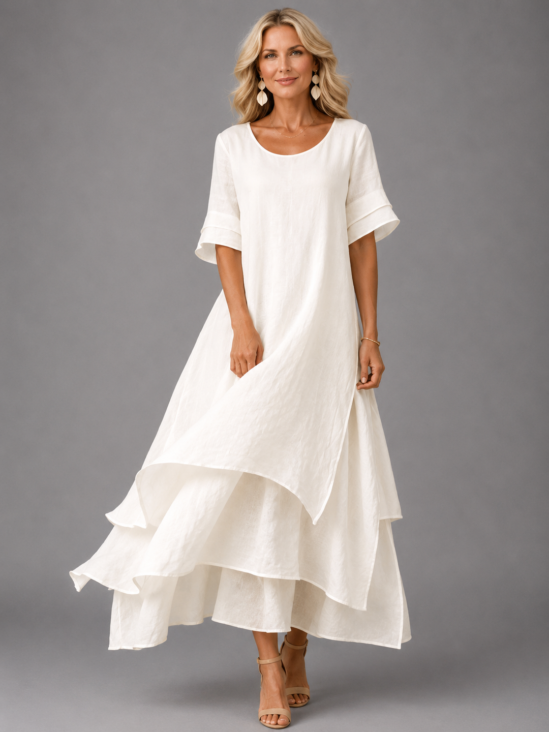 White maxi dress with short sleeves and tiered ruffle hem