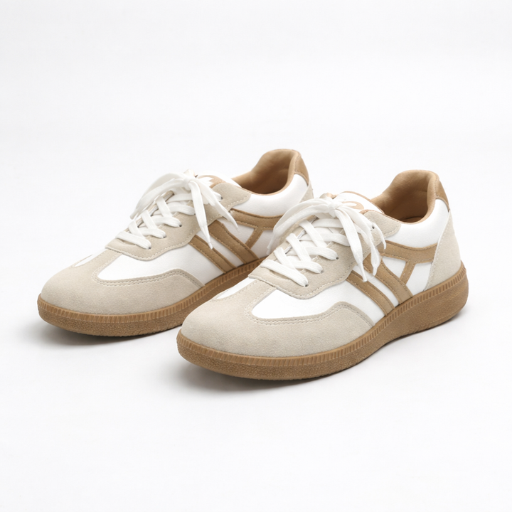 Low top lace-up sneakers in white and tan with white laces and gum sole