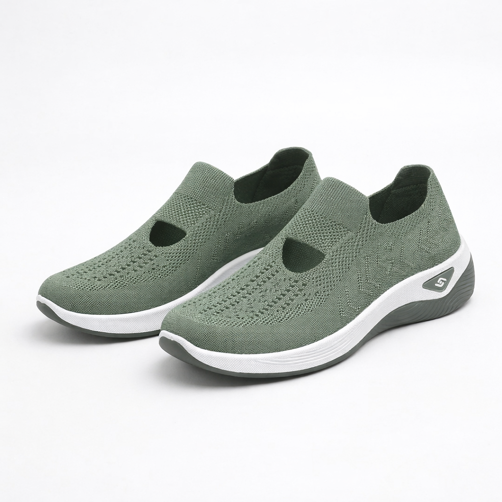 Green knit slip-on sneakers with white sole and cutout detail at heel