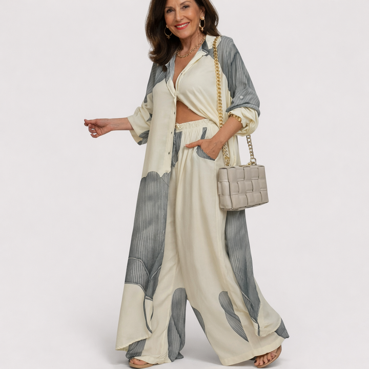 Gray flowing two-piece set with long draped jacket and wide-leg pants, open front