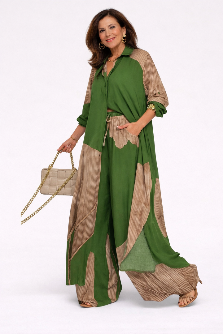 Green flowing two-piece set with long draped jacket and wide-leg pants, stripe trim