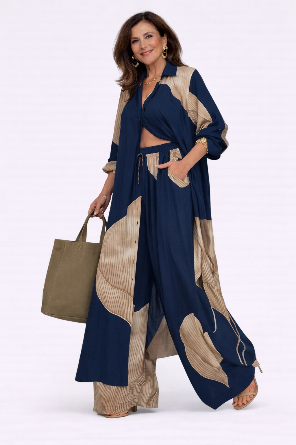 Navy and beige flowing two-piece set with long draped jacket and wide-leg pants, abstract print