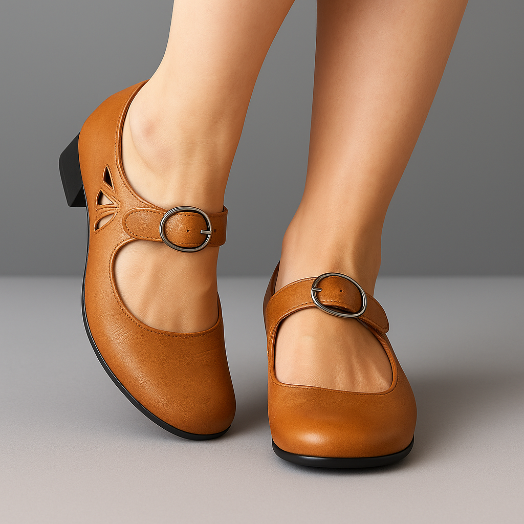 Tan leather low-heel Mary Jane shoes with buckle strap and cutout styling