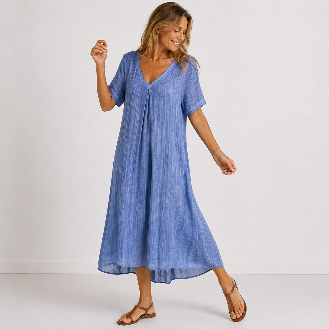 Blue linen V-neck midi dress with short sleeves, relaxed fit, and flowing hem
