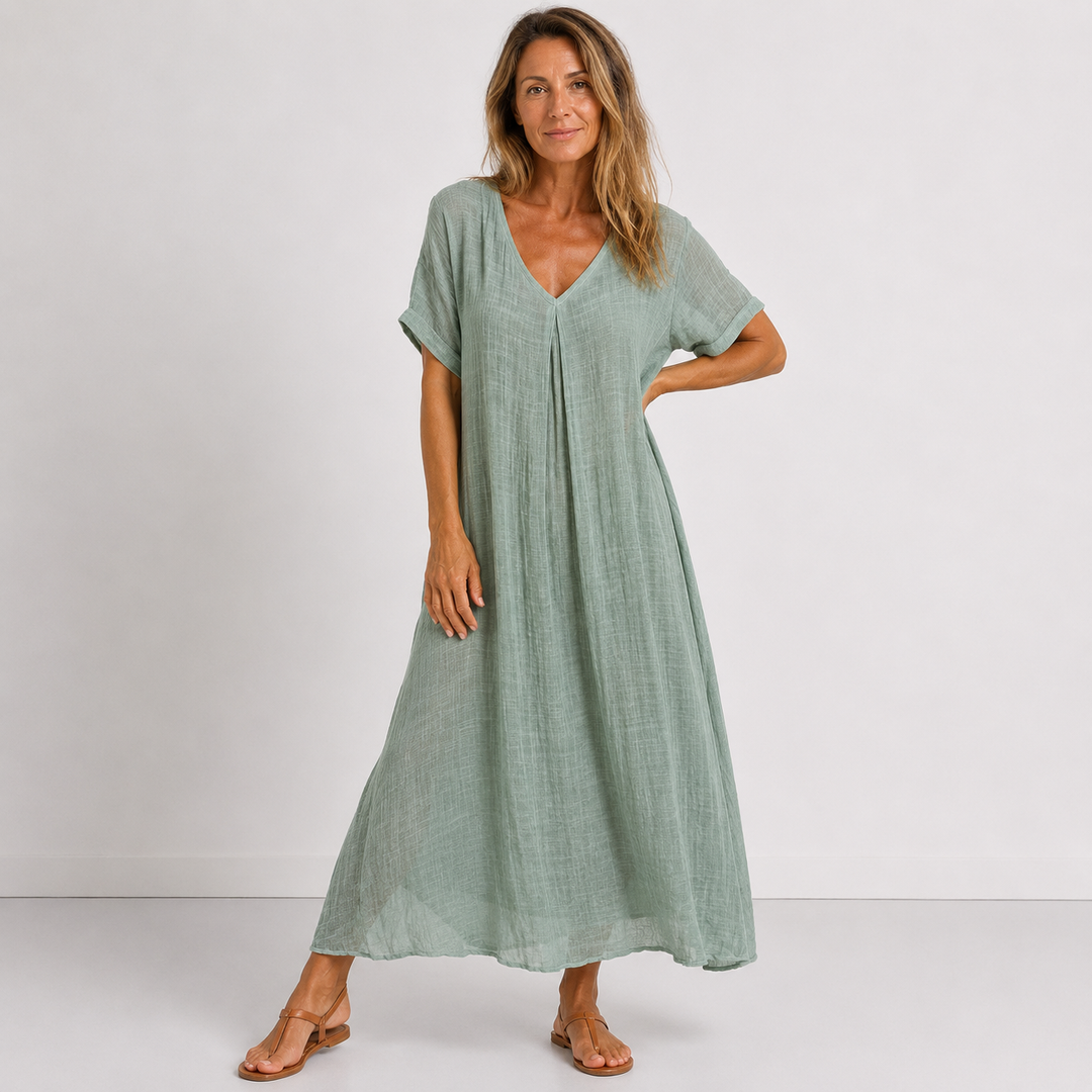 Green linen V-neck midi dress with short sleeves and relaxed gathered skirt