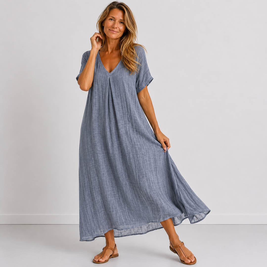 Blue linen V-neck midi dress with short sleeves, button front, and flared hem