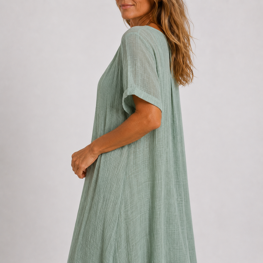 Green linen V-neck midi dress, short sleeves, flowing side drape and loose fit