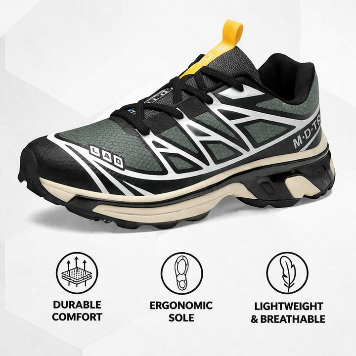 Lace-up walking sneaker in black with green accents, white zigzag panels, yellow pull tab