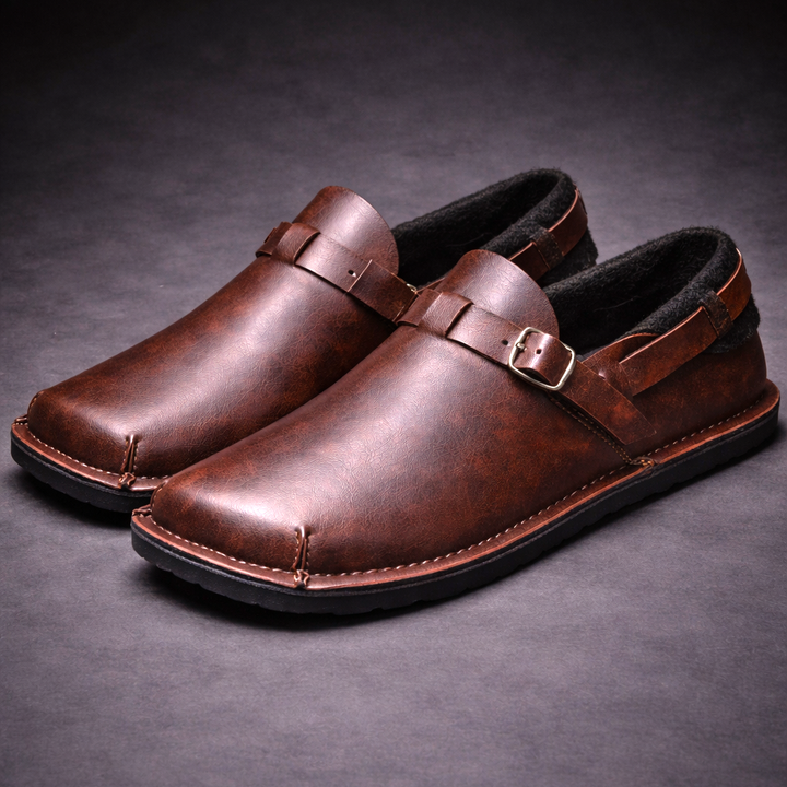 Brown leather loafer with metal buckle strap and stitched moc toe detail