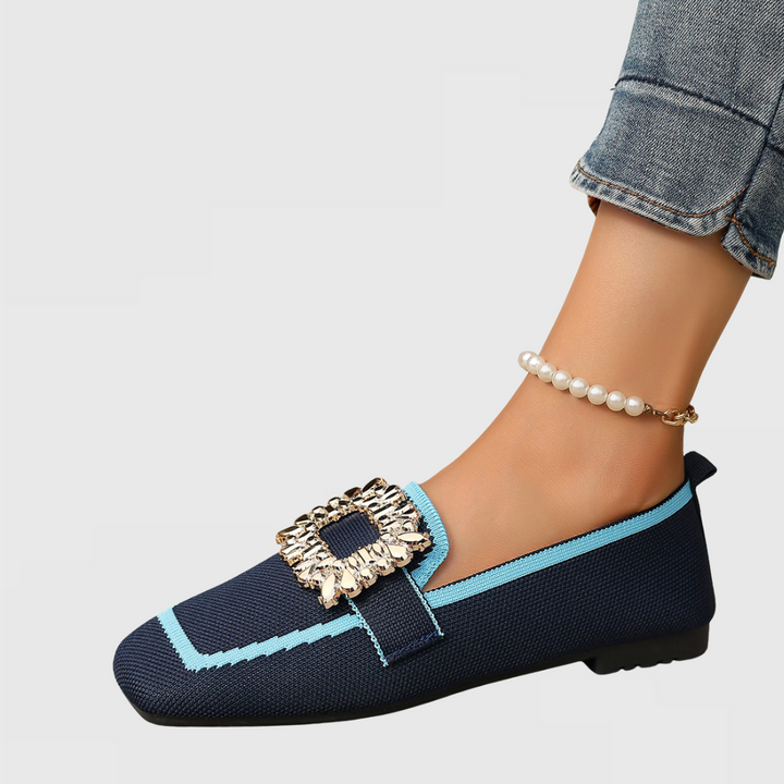 Navy square-toe flats with turquoise trim and rectangular gold jewel buckle