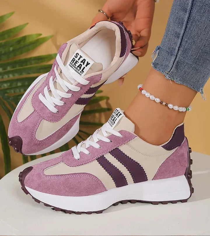 Purple and white retro lace-up sneakers with striped panels and rubber sole