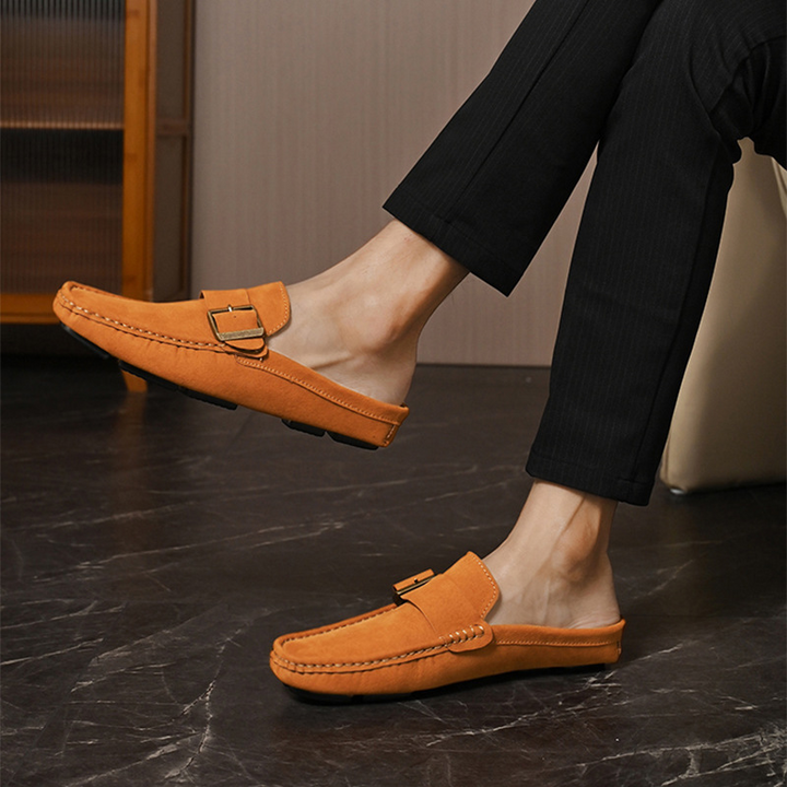 Orange suede loafers pair, side view with square metal buckle