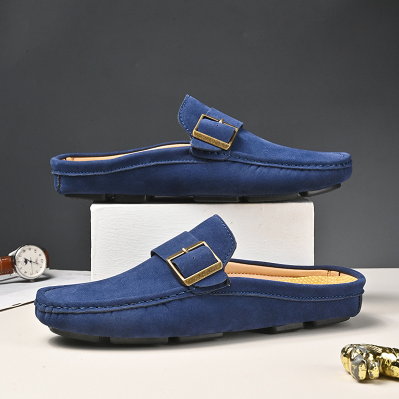 Navy suede loafers with gold buckle strap, closed-toe moc stitching